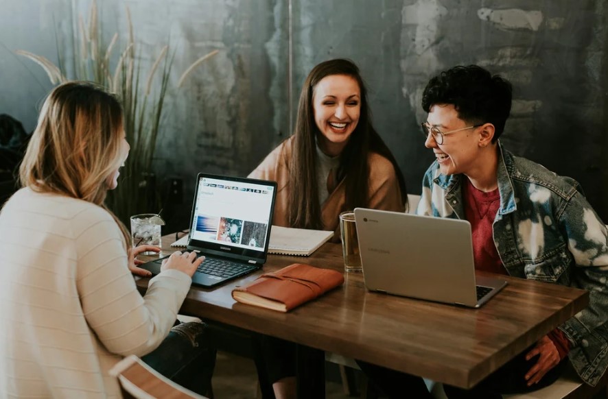 3 people taking with computers