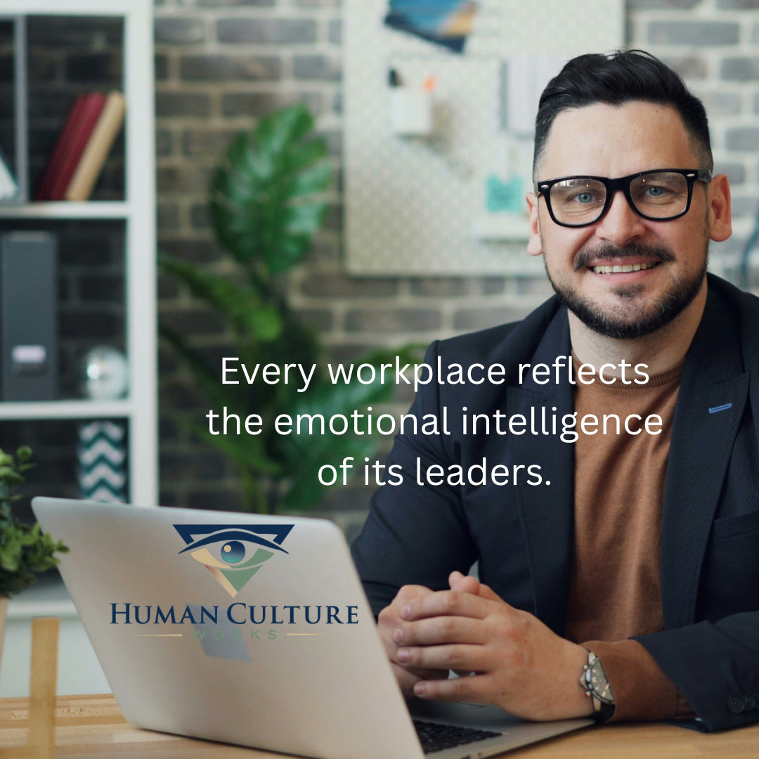 Every workplace reflects the emotional intelligence of its leaders, text over a smiling professional with a laptop