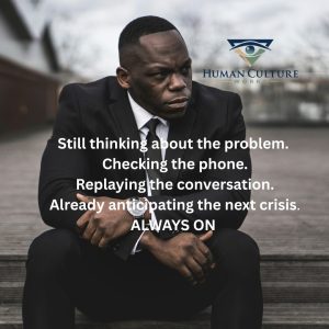 Still thinking about the problem, checking the phone, replaying the conversation, always on. Text over a leader sitting with a tense expression