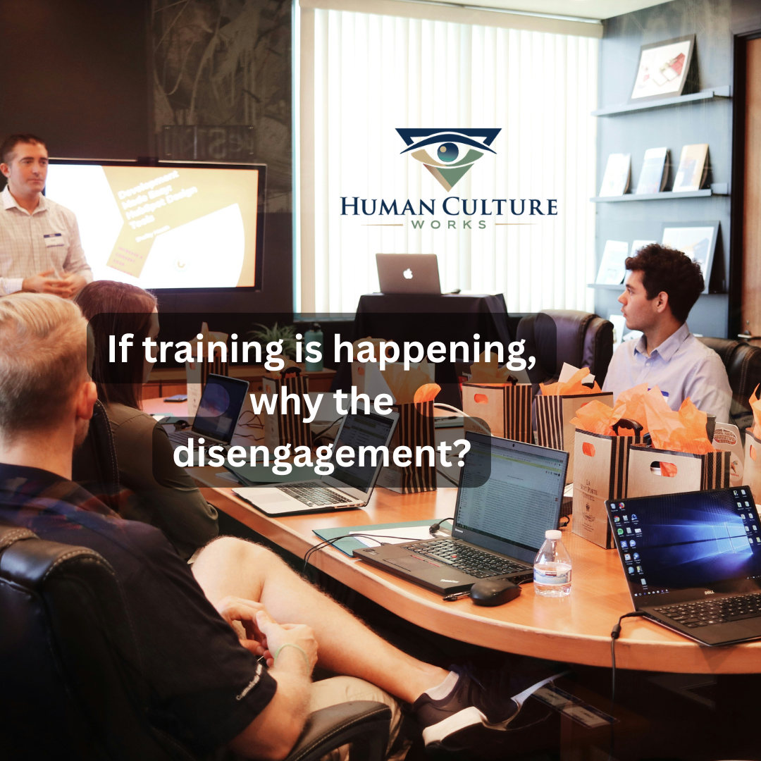If training is happening, why the disengagement? Text over a team meeting around a conference table